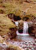 onw waterfall among many on the approach to Esk Hous