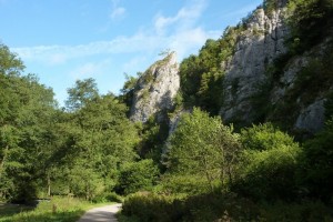 Ilam Rock stands out as a prominent landmark on the opposite bank of the river.
