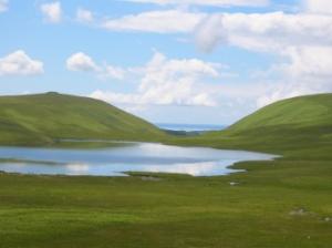 view over Burnmoor Tarn to the sea